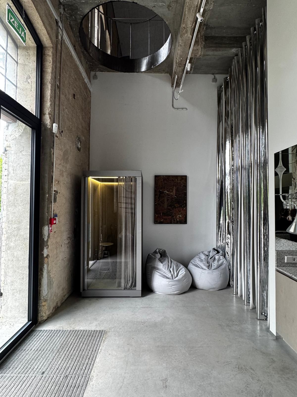 ARKA Silent SOLO acoustic phone booth installed in creative office interior